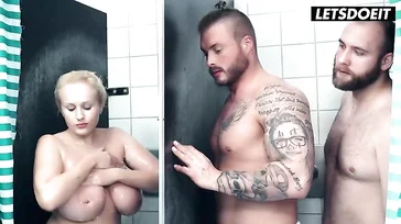 Busty blonde has a threesome with two strangers in a hostel