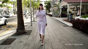 Naughty Lada walks around Spain in some see-through lingerie.