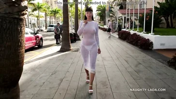 Naughty Lada walks around Spain in some see-through lingerie.