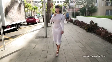 Naughty Lada walks around Spain in some see-through lingerie.