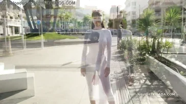 Naughty Lada walks around Spain in some see-through lingerie.