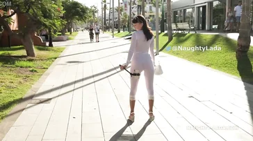 Naughty Lada walks around Spain in some see-through lingerie.