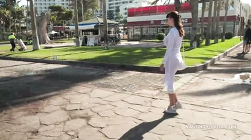 Naughty Lada walks around Spain in some see-through lingerie.