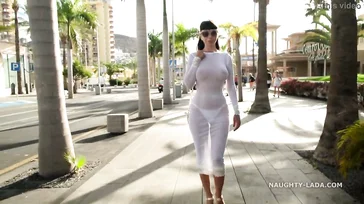 Naughty Lada walks around Spain in some see-through lingerie.