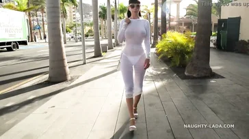 Naughty Lada walks around Spain in some see-through lingerie.