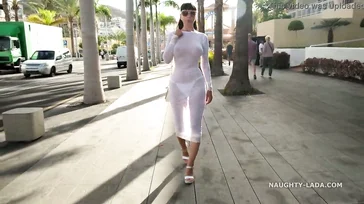 Naughty Lada walks around Spain in some see-through lingerie.