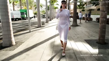 Naughty Lada walks around Spain in some see-through lingerie.