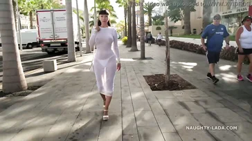 Naughty Lada walks around Spain in some see-through lingerie.